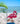 Painted Pink flamingo bracket on a beach with ocean and palm leaves in the background