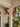 painted cardinal decorative brackets on corner of porch