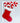 Decorative mailbox/ porch bracket made from pvc in shape of stocking with candy canes sticking out of top and hand-painted in bright red and white

