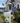 white mailbox with decorative white pvc crab next to coastal house with white pvc crab wall art on the house
