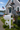 white mailbox with decorative white pvc crab next to coastal house with white pvc crab wall art on the house
