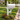 white pvc deer decorative bracket under a white mailbox post in front of a house