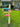 Decorative mailbox with flamingo bracket design on a grassy lawn