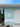 heron house plaque with house numbers on teal coastal house