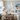 white lighthouse decor on wall of coastal living room
