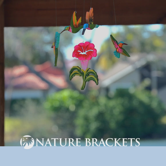 decorative mobile featuring hummingbirds around a flower made from white pvc brightly colored 