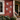 Four white weather-resistant snowflake wall decorations displayed on a red wooden house with holiday decor