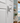 Decorative starfish on a white door with a beach-themed room in the background