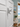 Decorative starfish on a white door with a beach-themed room in the background